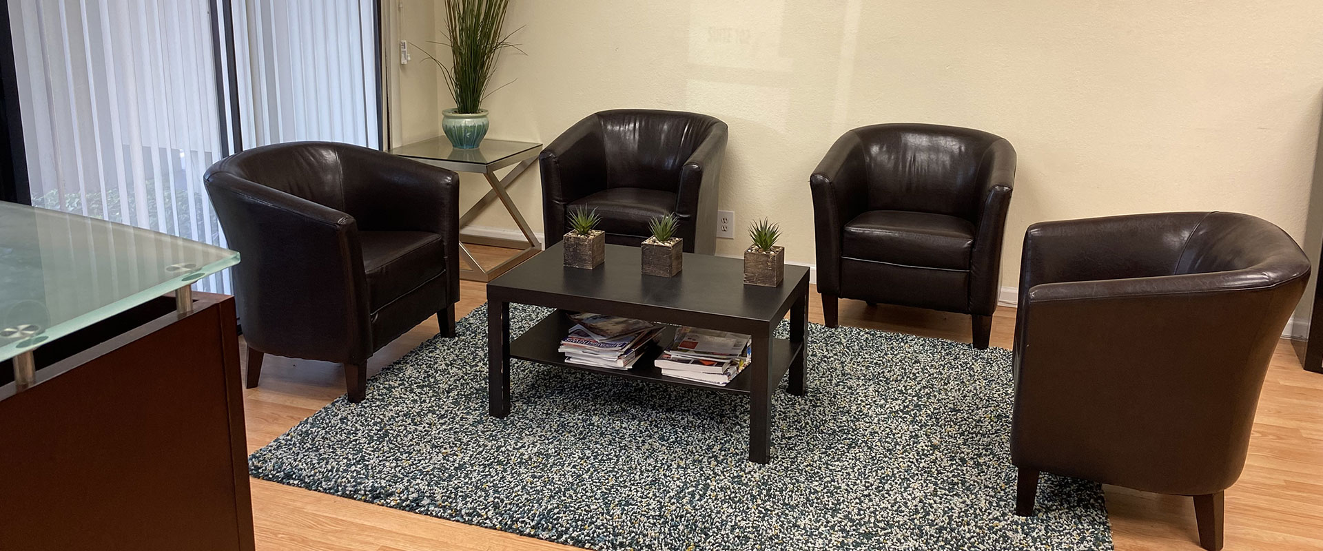 A living room with two chairs and a coffee table